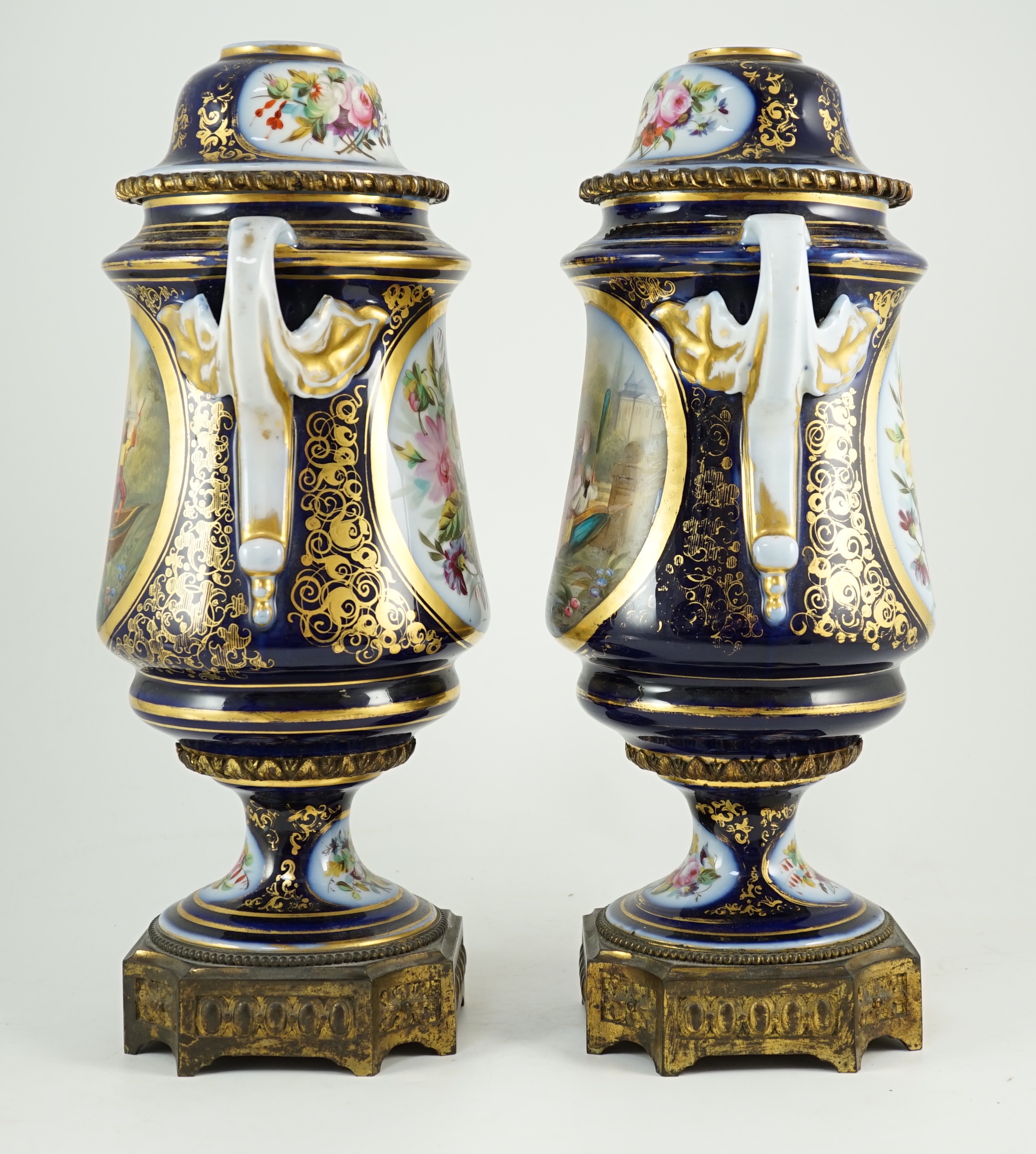 A pair of Sevres style Paris porcelain and ormolu mounted oil lamps, late 19th century, 43 cm high